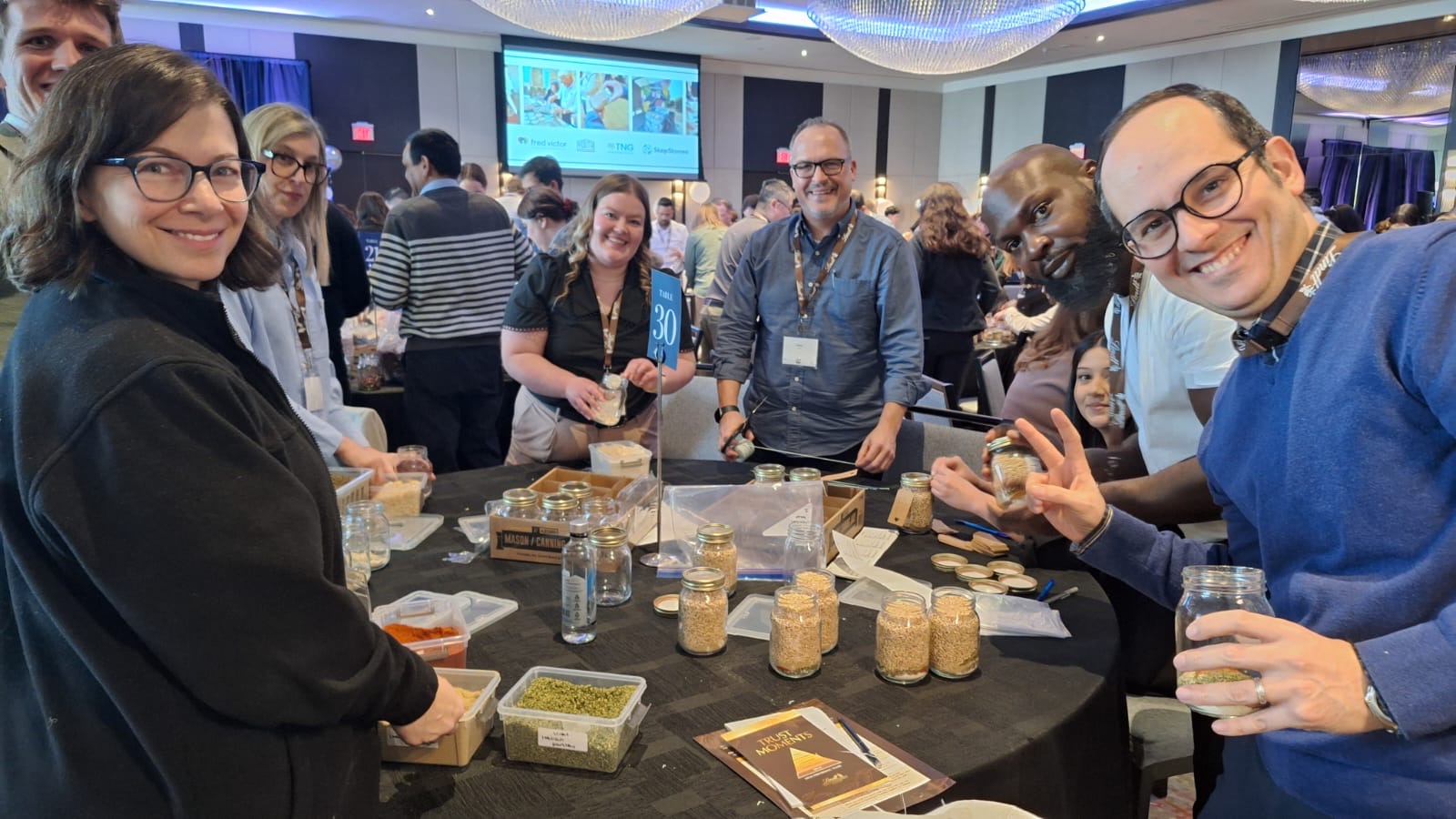 Team building around a table at a WholeHearted program